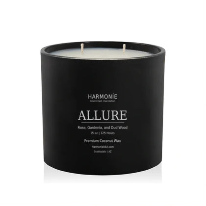 Allure 15 oz coconut wax candle by Harmonie, featuring rose, gardenia, and oud wood, with matte black printed label.