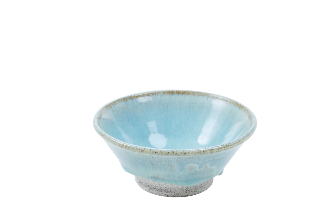 Four-ounce dragonfruit clay bowl with turquoise glaze pooling toward the base