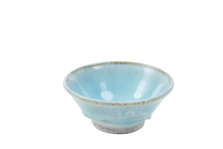 Four-ounce dragonfruit clay bowl with turquoise glaze pooling toward the base