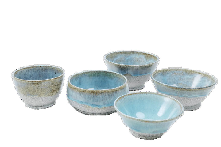 Five blue-glazed dragonfruit clay bowls in graduated sizes grouped together