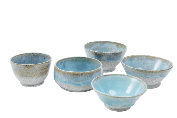 Five blue-glazed dragonfruit clay bowls in graduated sizes grouped together