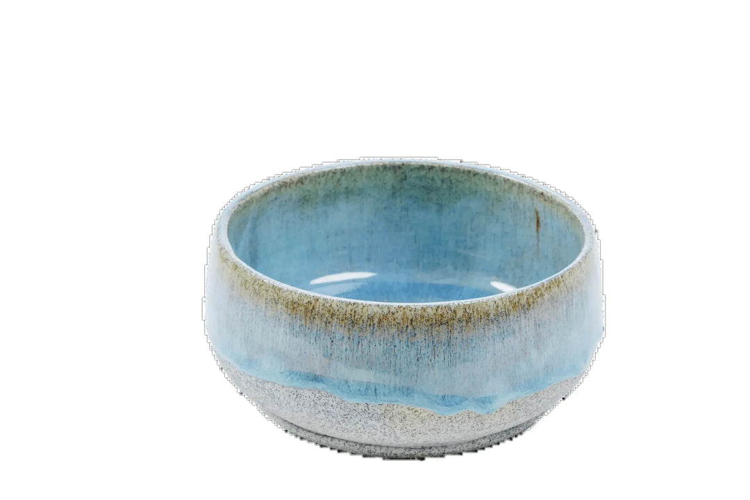 Wide blue-glazed stoneware bowls showing the unglazed speckled exterior
