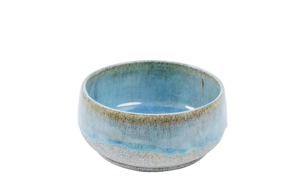 Wide blue-glazed stoneware bowls showing the unglazed speckled exterior