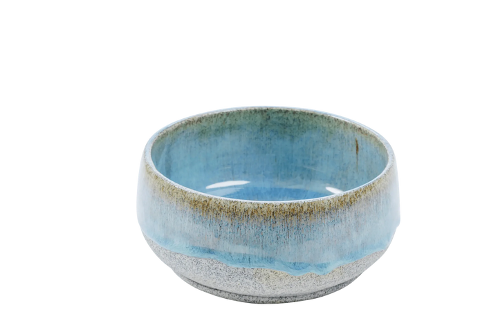 Wide blue-glazed stoneware bowls showing the unglazed speckled exterior