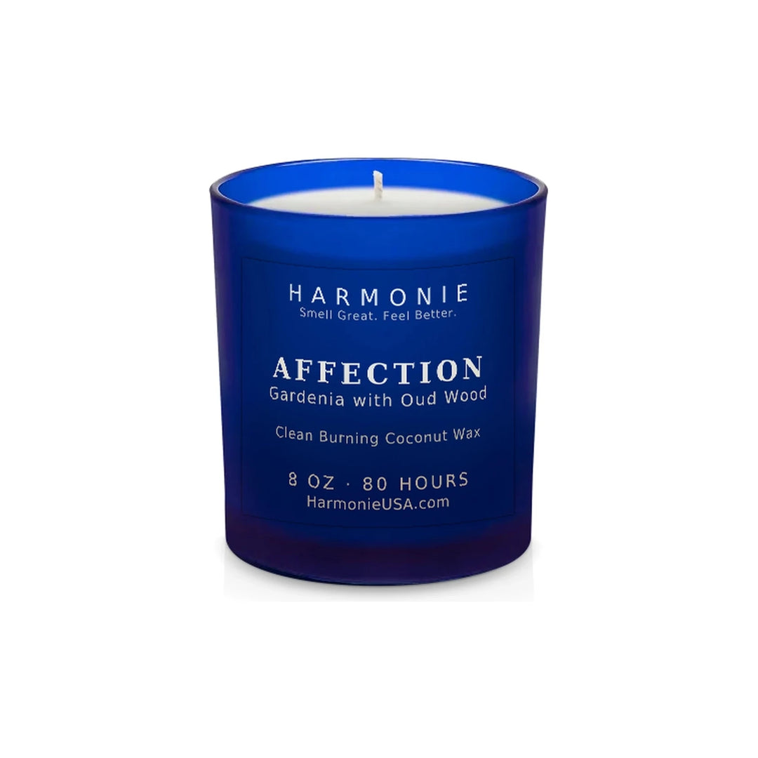 Harmonie Affection coconut wax candle, 8 oz, 80 hour burn time, frosted sapphire blue glass vessel with a single wick, unlit, on a white background