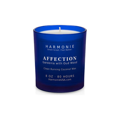 Harmonie Affection coconut wax candle, 8 oz, 80 hour burn time, frosted sapphire blue glass vessel with a single wick, unlit, on a white background