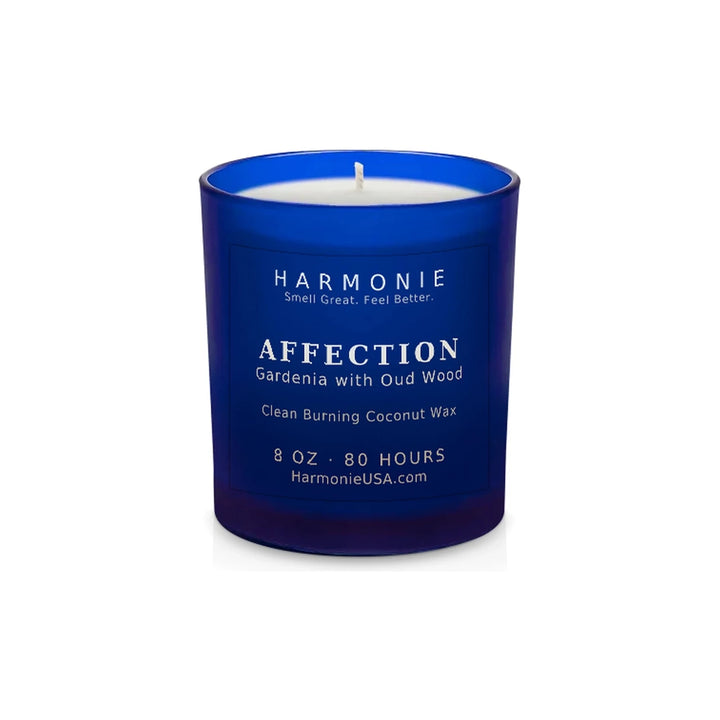 Harmonie Affection coconut wax candle, 8 oz, 80 hour burn time, frosted sapphire blue glass vessel with a single wick, unlit, on a white background