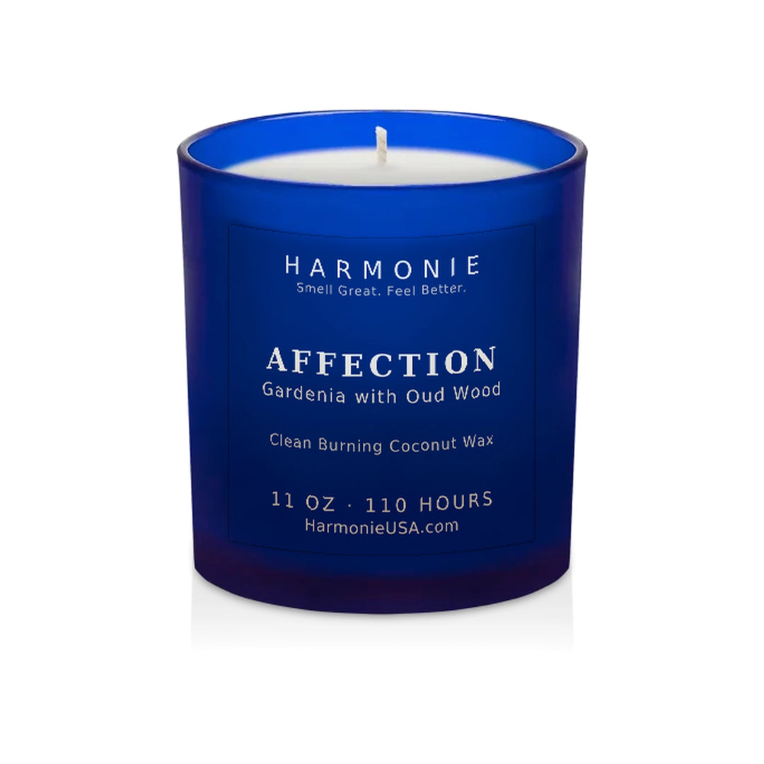 Harmonie Affection coconut wax candle, 11 oz, 125 hour burn time, frosted sapphire blue glass vessel with a single wick, unlit, on a white background