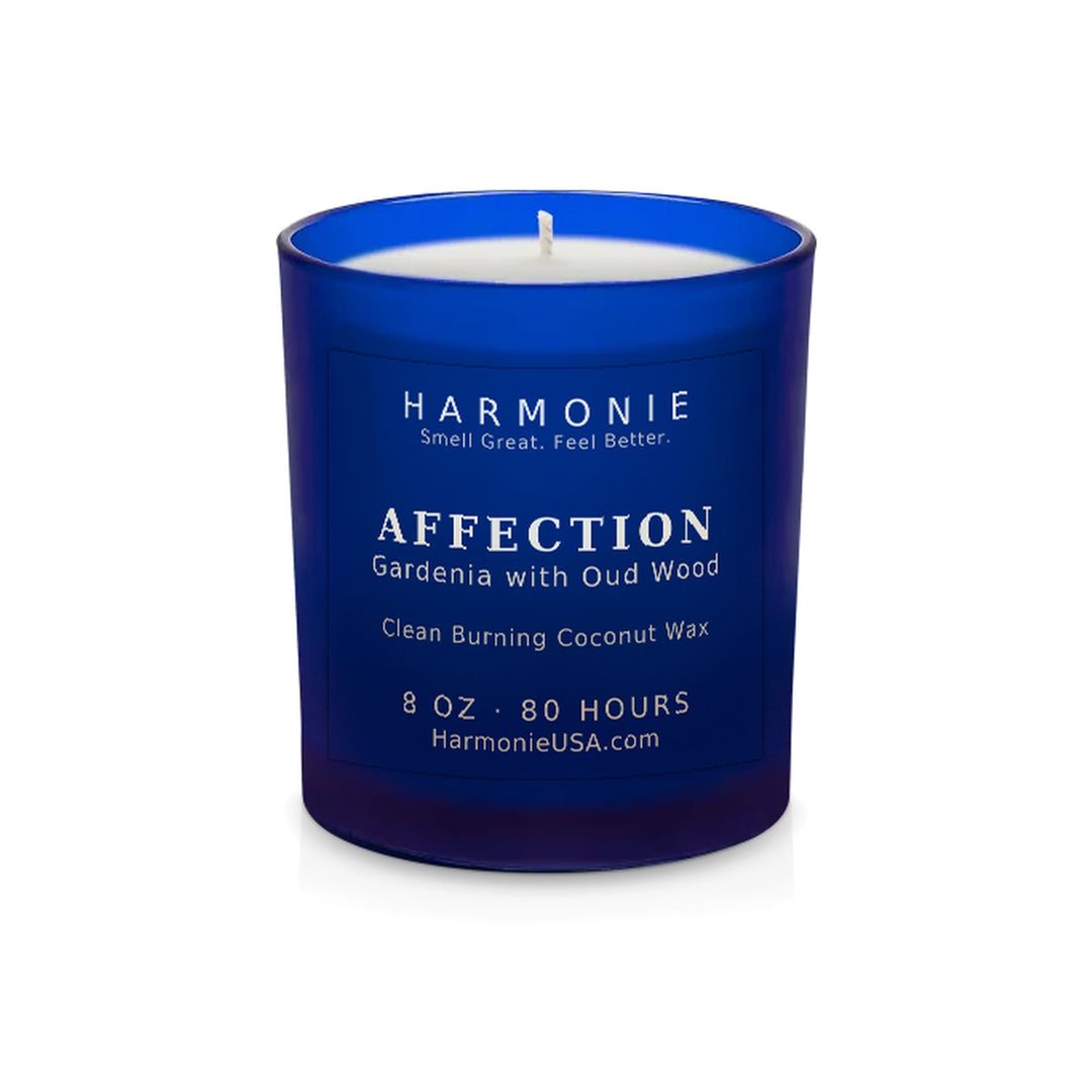 Harmonie Affection coconut wax candle, 8 oz, 80 hour burn time, frosted sapphire blue glass vessel with a single wick, unlit, on a white background