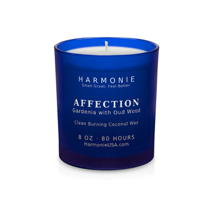Harmonie Affection coconut wax candle, 8 oz, 80 hour burn time, frosted sapphire blue glass vessel with a single wick, unlit, on a white background