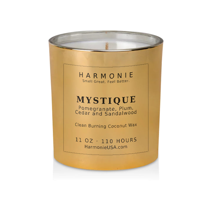 Harmonie Mystique coconut wax candle, 11 oz, 125 hour burn time, electroplated gold glass vessel with a single wick, unlit, on a white background