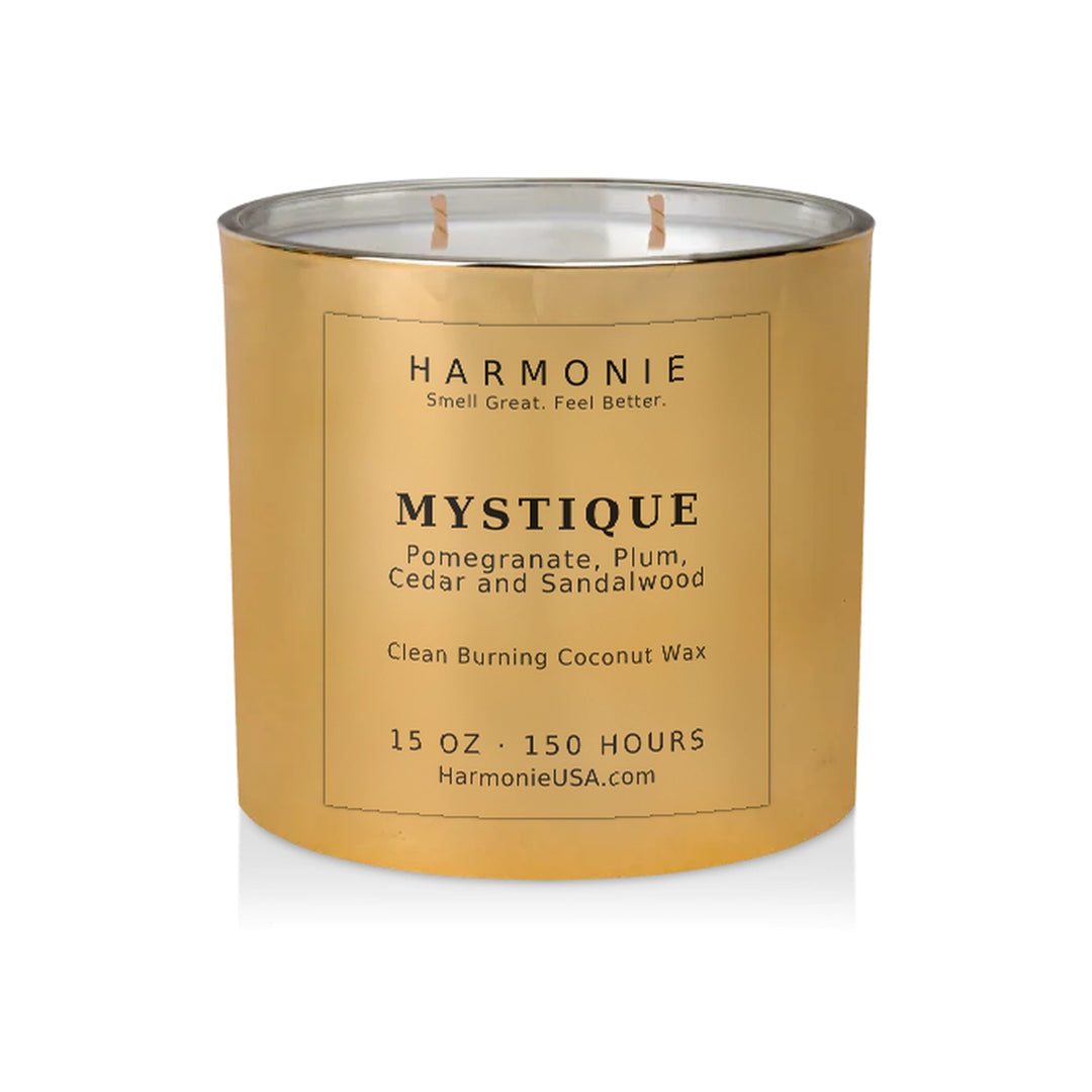 Harmonie Mystique coconut wax candle, 15 oz, 150 hour burn time, electroplated gold glass vessel with two wicks, unlit, on a white background