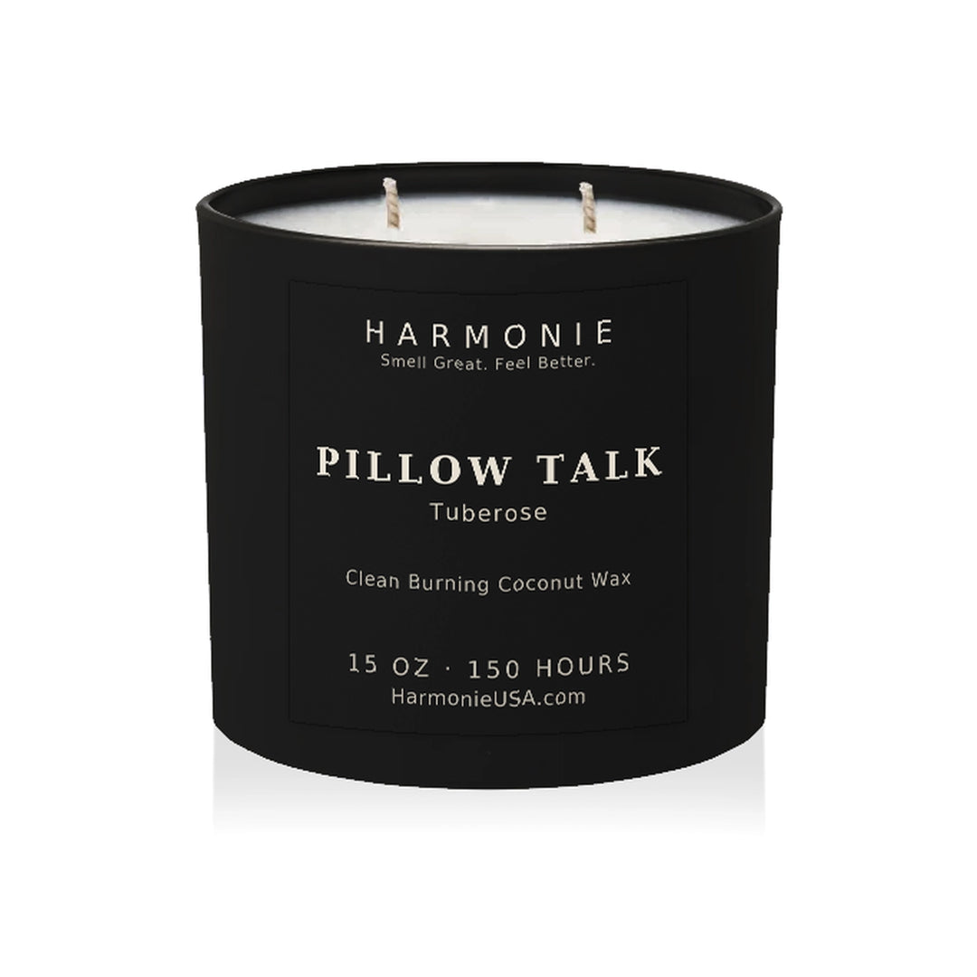 Harmonie Pillow Talk coconut wax candle, 15 oz, 150 hour burn time, matte black glass vessel with two wicks, unlit, on a white background