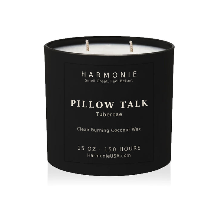 Harmonie Pillow Talk coconut wax candle, 15 oz, 150 hour burn time, matte black glass vessel with two wicks, unlit, on a white background