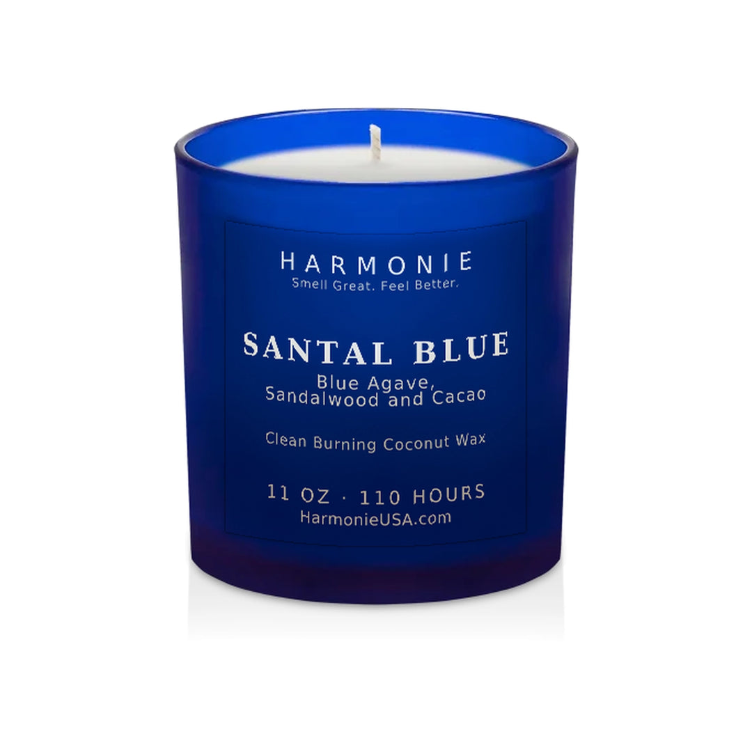 Harmonie Santal Blue coconut wax candle, 11 oz, 125 hour burn time, frosted sapphire blue glass vessel with a single wick, unlit, on a white background