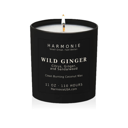 Harmonie Wild Ginger coconut wax candle, 11 oz, 110 hour burn time, matte black glass vessel with a single lit wick, on a white background