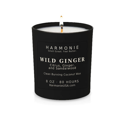 Harmonie Wild Ginger coconut wax candle, 8 oz, 80 hour burn time, matte black glass vessel with a single lit wick, on a white background