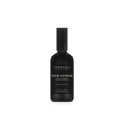 Harmonie Wild Ginger 3.4 oz hair and body mist, citrus, ginger, and sandalwood, matte black glass spray bottle on a white background