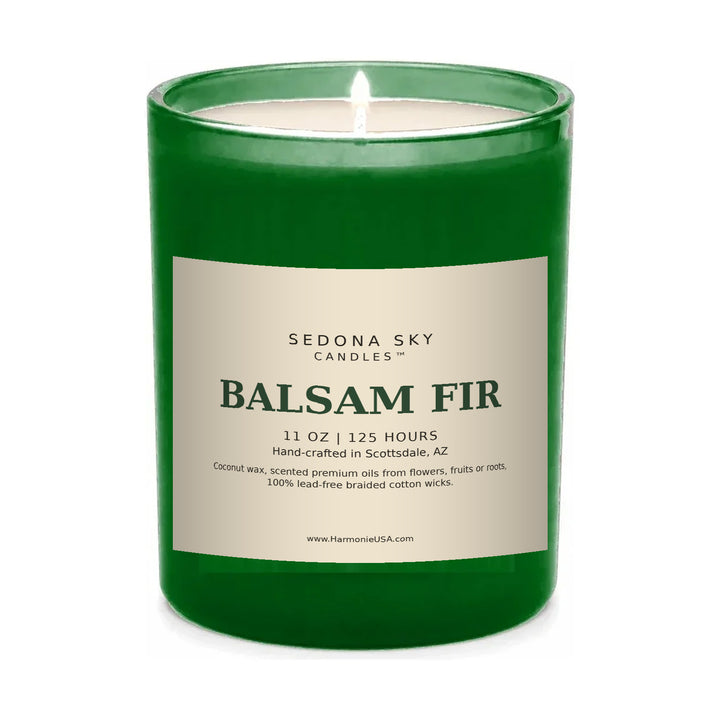 Sedona Sky Balsam Fir coconut wax candle, 11 oz green glass jar, lit, on white background