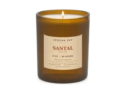 Santal Desire 8 oz coconut wax candle in amber glass, lit