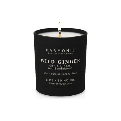 Harmonie Wild Ginger coconut wax candle, 8 oz, 80 hour burn time, matte black glass vessel with a single lit wick, on a white background