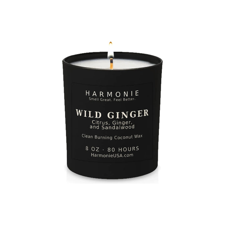Harmonie Wild Ginger coconut wax candle, 8 oz, 80 hour burn time, matte black glass vessel with a single lit wick, on a white background