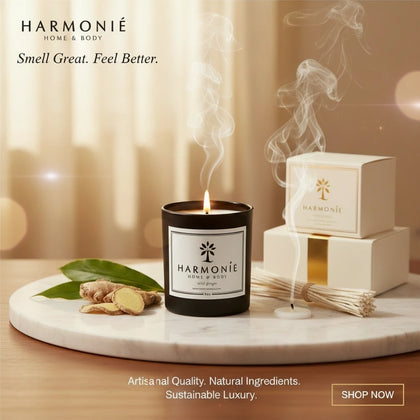 Harmonie Wild Ginger 8oz candle lit on a marble tray with fresh ginger root and gift box - Artisanal Quality. Natural Ingredients. Sustainable Luxury.